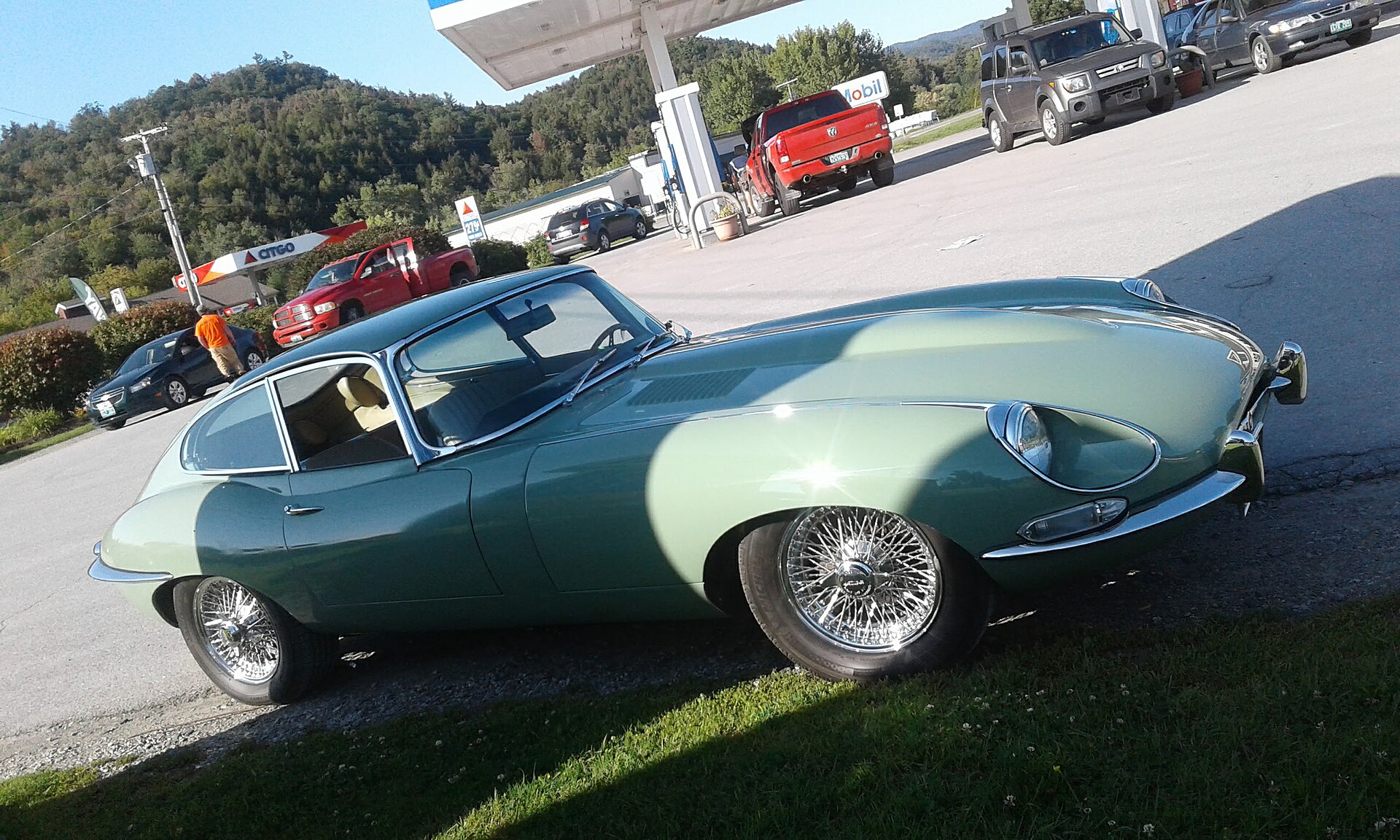 Parked Jaguar E-Type used as a profile cover